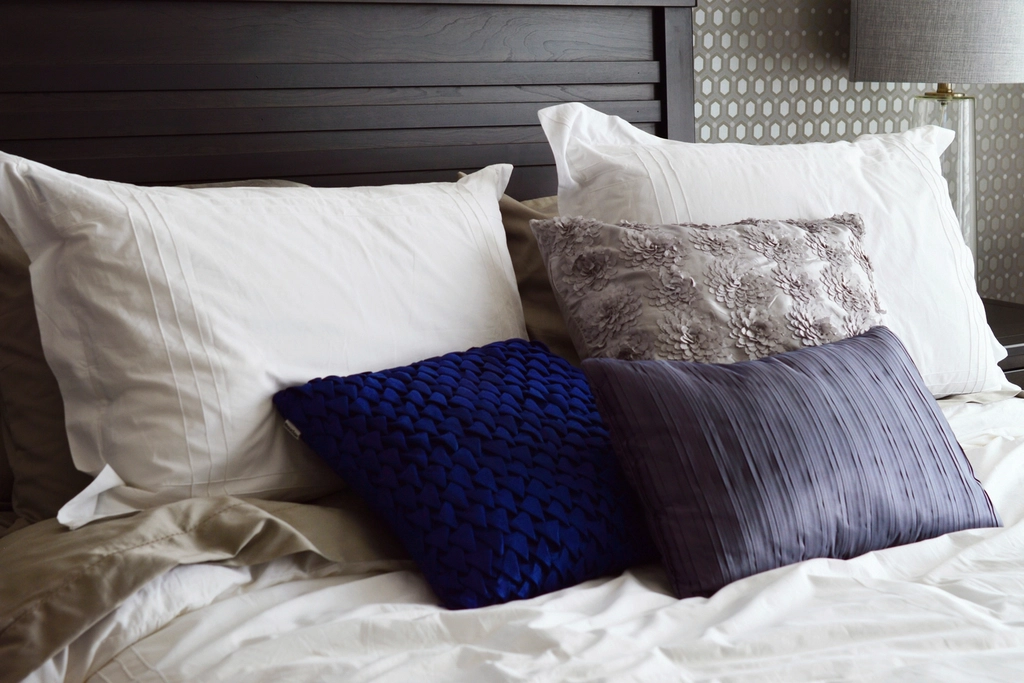 Made bed with fresh pillows